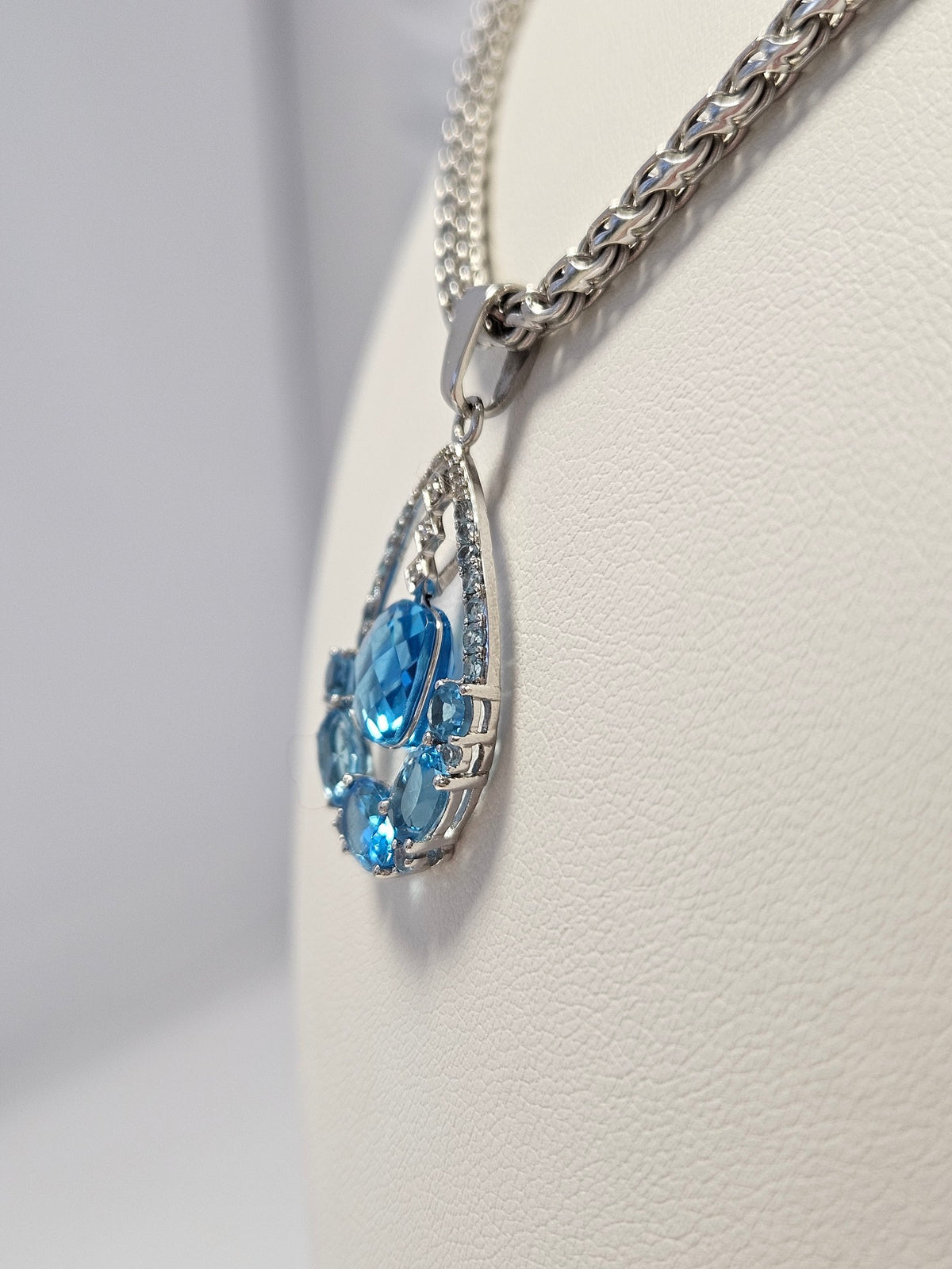 14K White Gold Blue Topaz & 12 Diamond Pendant