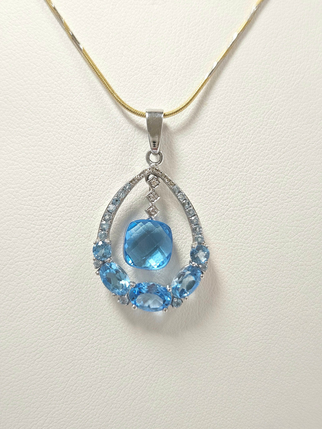 14K White Gold Blue Topaz & 12 Diamond Pendant