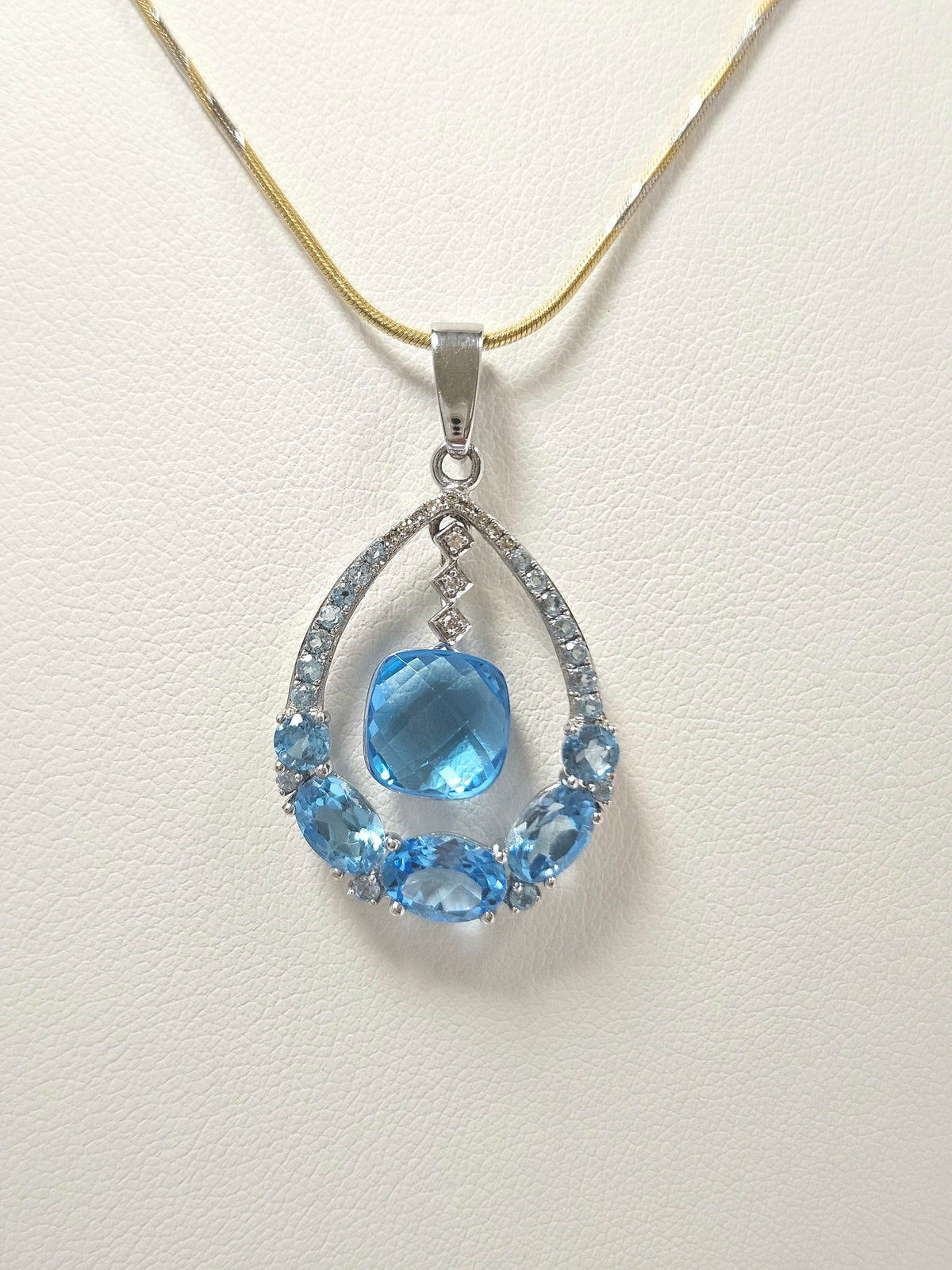 14K White Gold Blue Topaz & 12 Diamond Pendant
