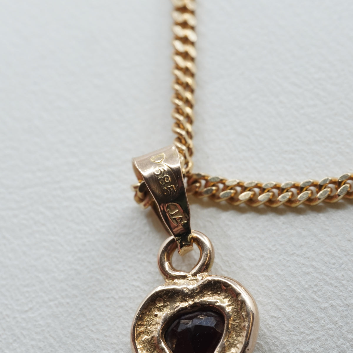 14K Gold Heart Pendant with Dark Stone